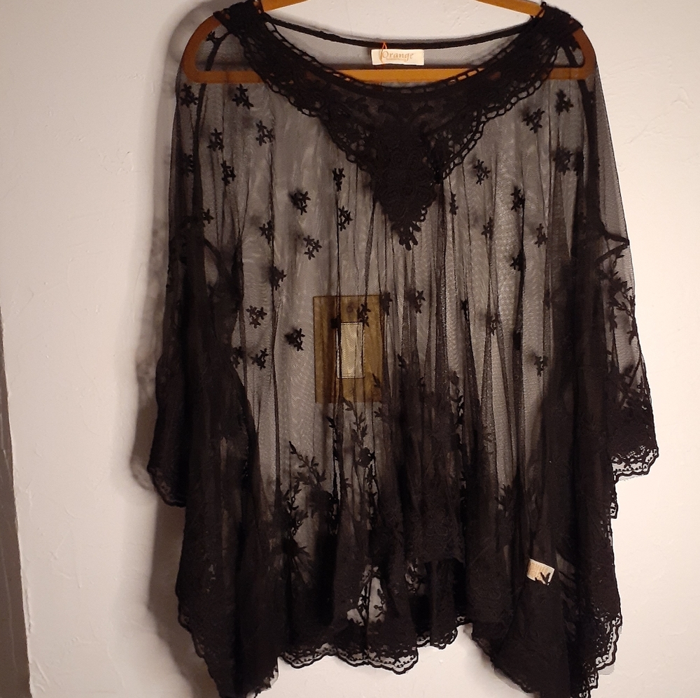 Orange fashion Village black lace overlay top.